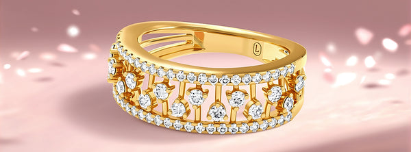 Gold ring with diamonds on a pink background