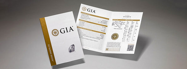 GIA (Gemological Institute of America) brochures on a gray background GIA (Gemological Institute of America) brochures on a gray background