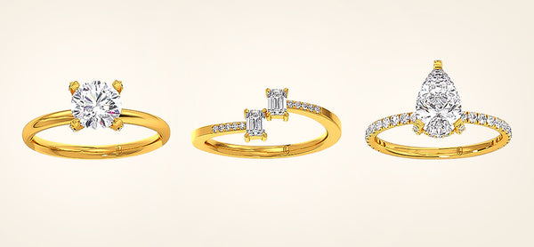 Three gold rings with diamond designs on a beige background