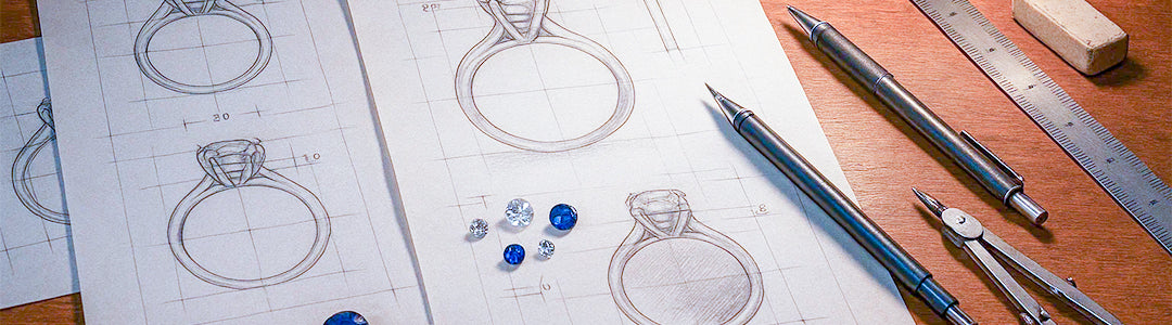 Designs of rings on paper with drafting tools on a wooden surface