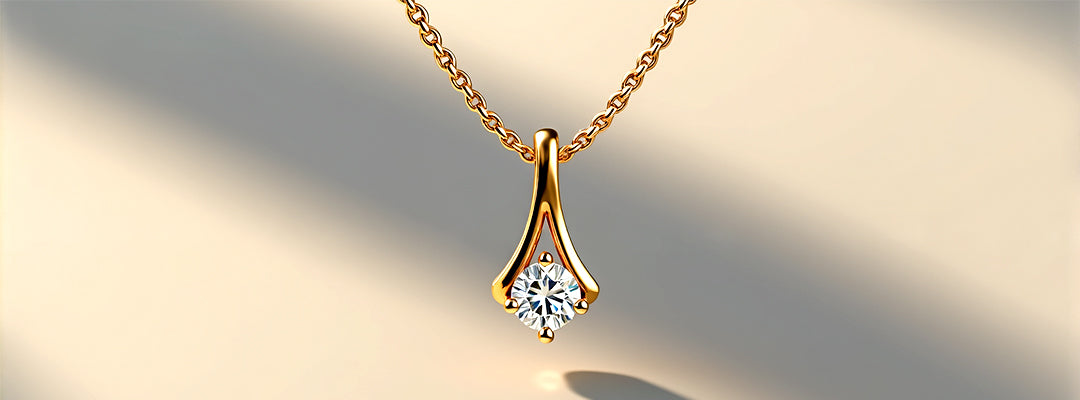 Gold necklace with a diamond pendant on a soft beige background