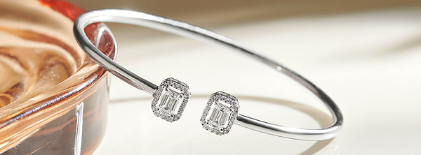 Silver bracelet with diamond accents on a soft background