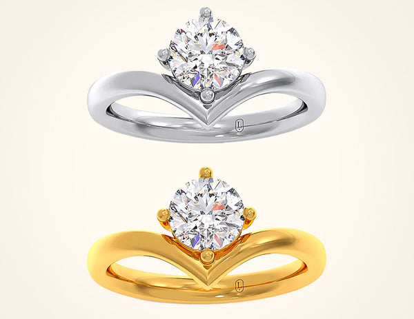 Gold and silver diamond rings on a beige background