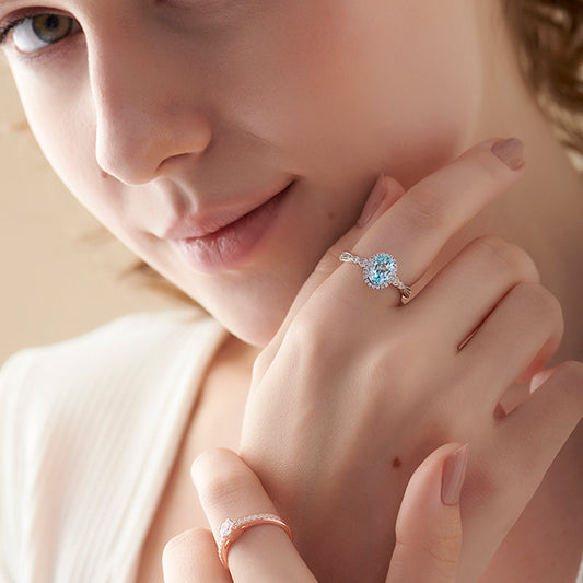 Oval Blue Gemstone and Round Diamond Halo Ring Oval Blue Gemstone and Round Diamond Halo Ring