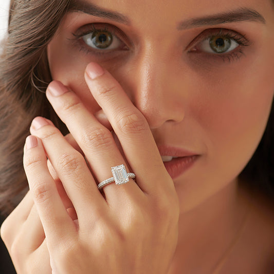 Luminous Emerald With Round Side Stone Diamond Ring Luminous Emerald With Round Side Stone Diamond Ring