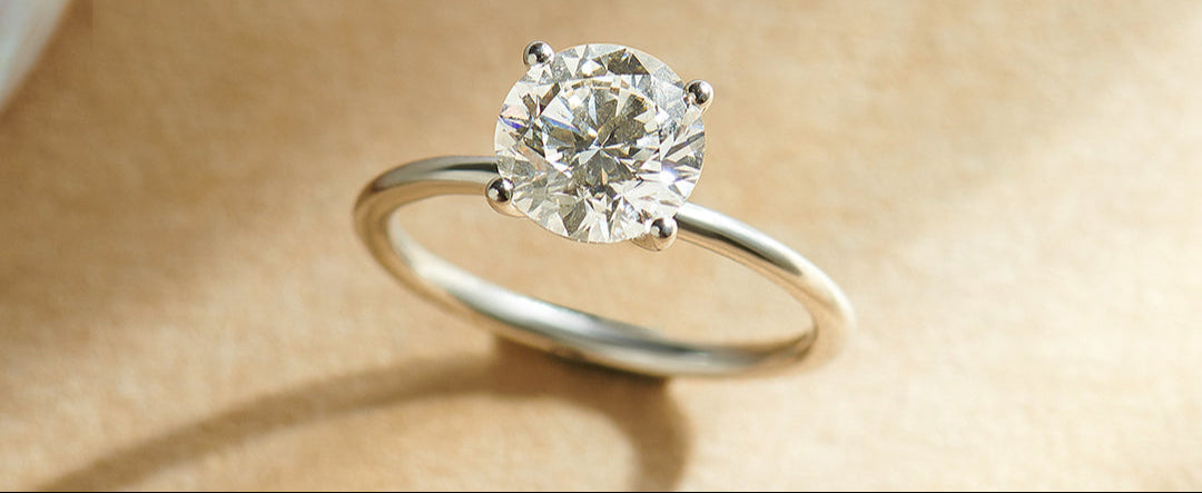 Diamond ring on a beige background