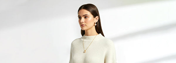 Woman wearing a white sweater with a blurred background