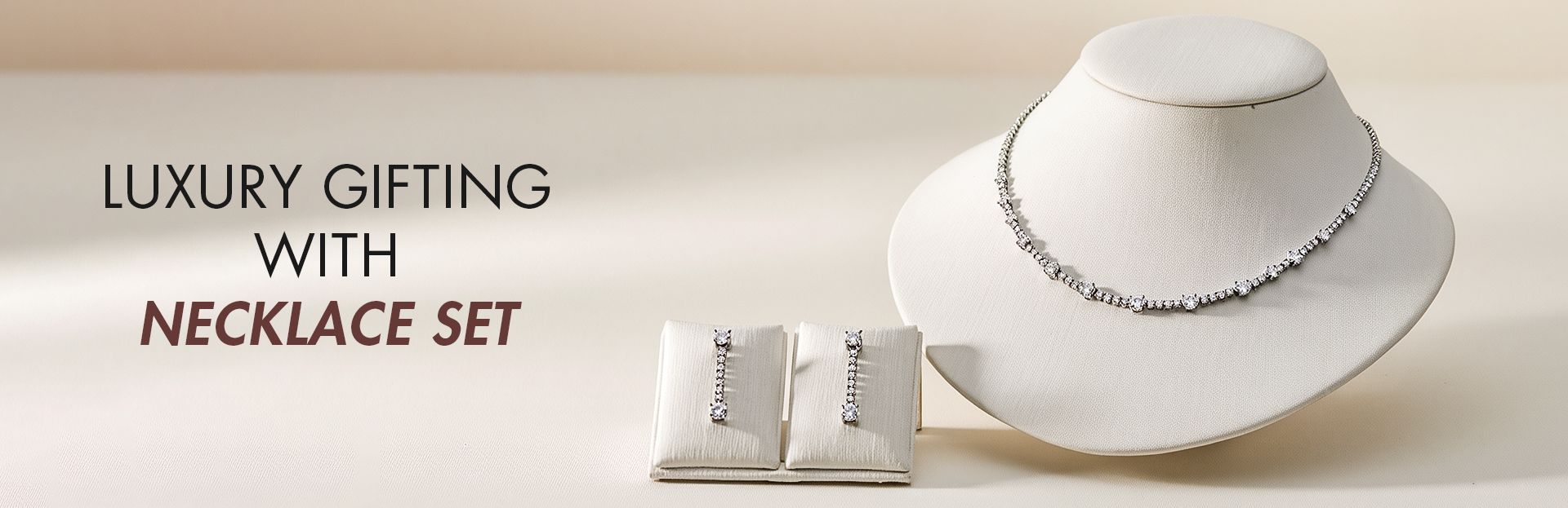 Necklace set on a mannequin and box with 'Luxury Gifting with Necklace Set' text.