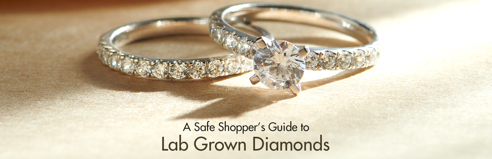 Two diamond rings on a beige background with text about lab-grown diamonds.