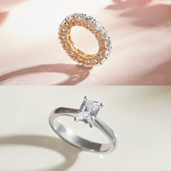 Two diamond rings on a soft pink background